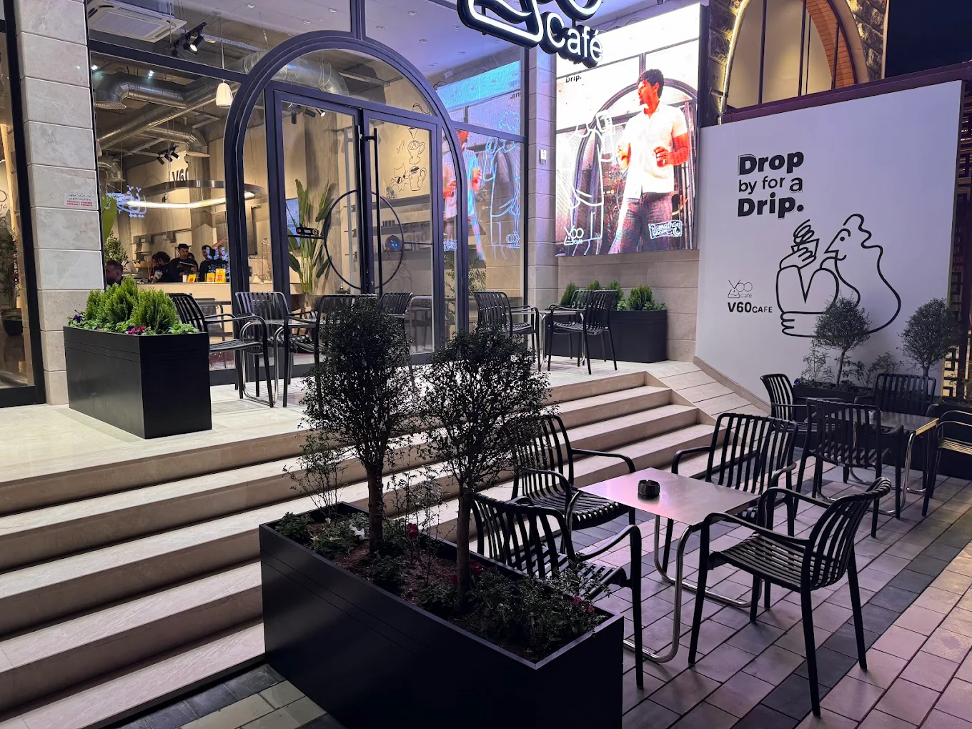 V60 Café's illuminated exterior terrace in Baghdad